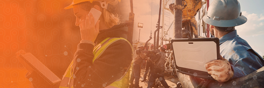 Male and female field services workers using mobile devices while on the job.