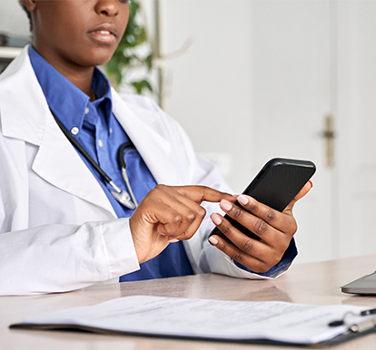 Snapshot of a Doctor Using a Mobile Device