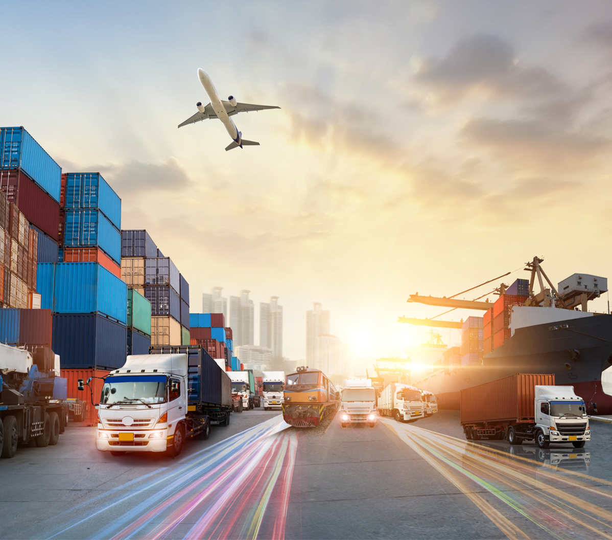 Image of a Outdoor port with planes and trucks going to deliver goods